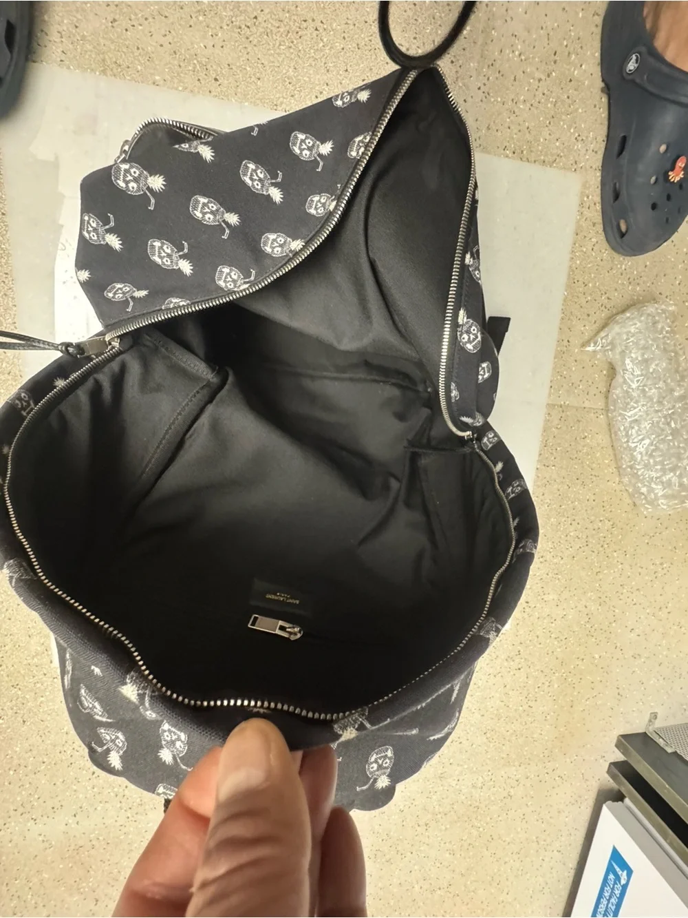 Saint Laurent Black Canvas Backpack with White Pineapple Skull Motif